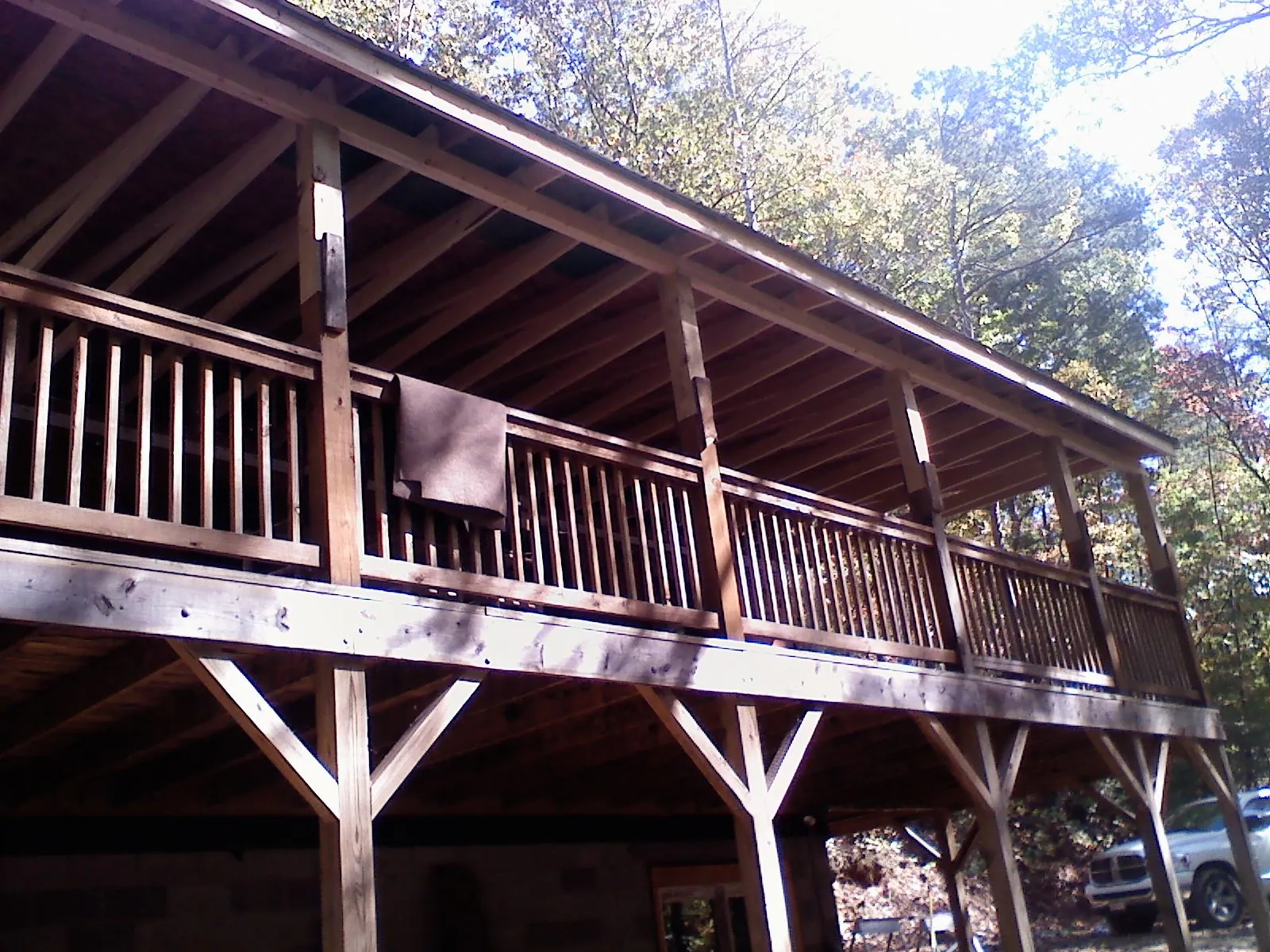 Timber framing under a new elevated porch and deck — Roof Leak Repair in Carney by Roofing Brothers
